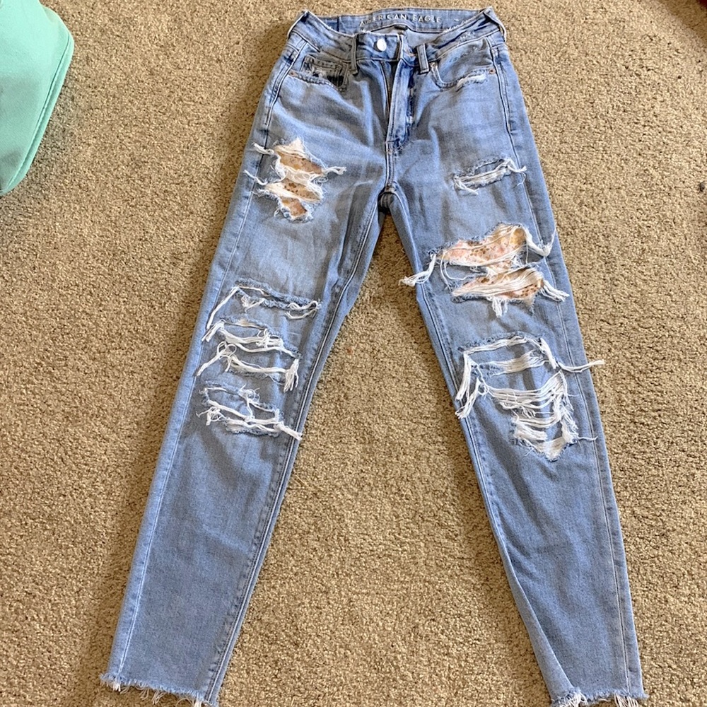 Distressed patch skinny jeans.